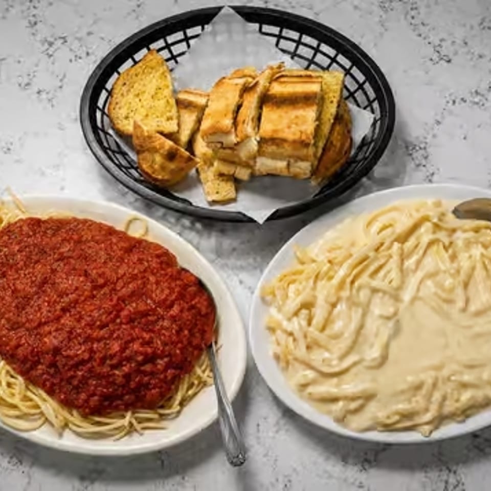 Vittoria pasta plates with garlic bread.